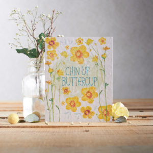 Seed paper plantable card with the message Chin up buttercup